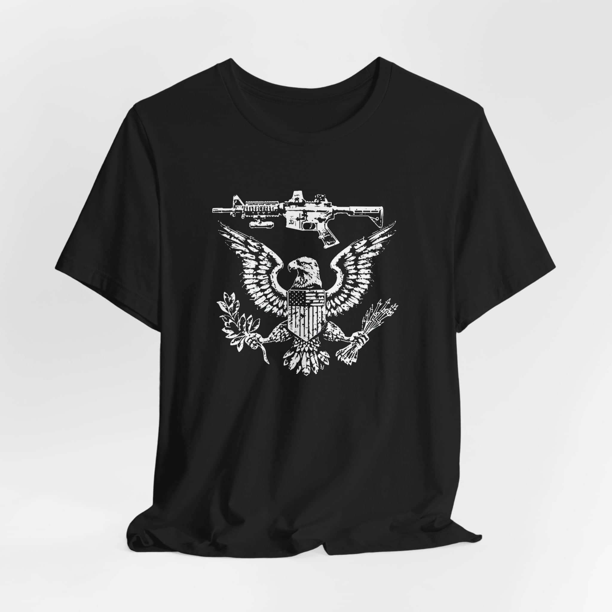 Patriotic Eagle and Rifle T-Shirt, American Flag Inspired Military Graphic Tee, Bold Eagle & Rifle Design, Proud USA Themed Apparel Unisex Jersey Short Sleeve Tee