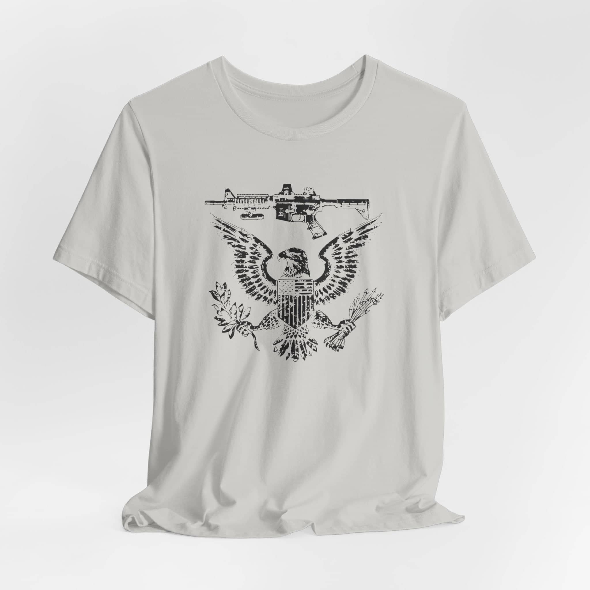 Patriotic Eagle and Rifle T-Shirt, American Flag Inspired Military Graphic Tee, Bold Eagle & Rifle Design, Proud USA Themed Apparel Unisex Jersey Short Sleeve Tee